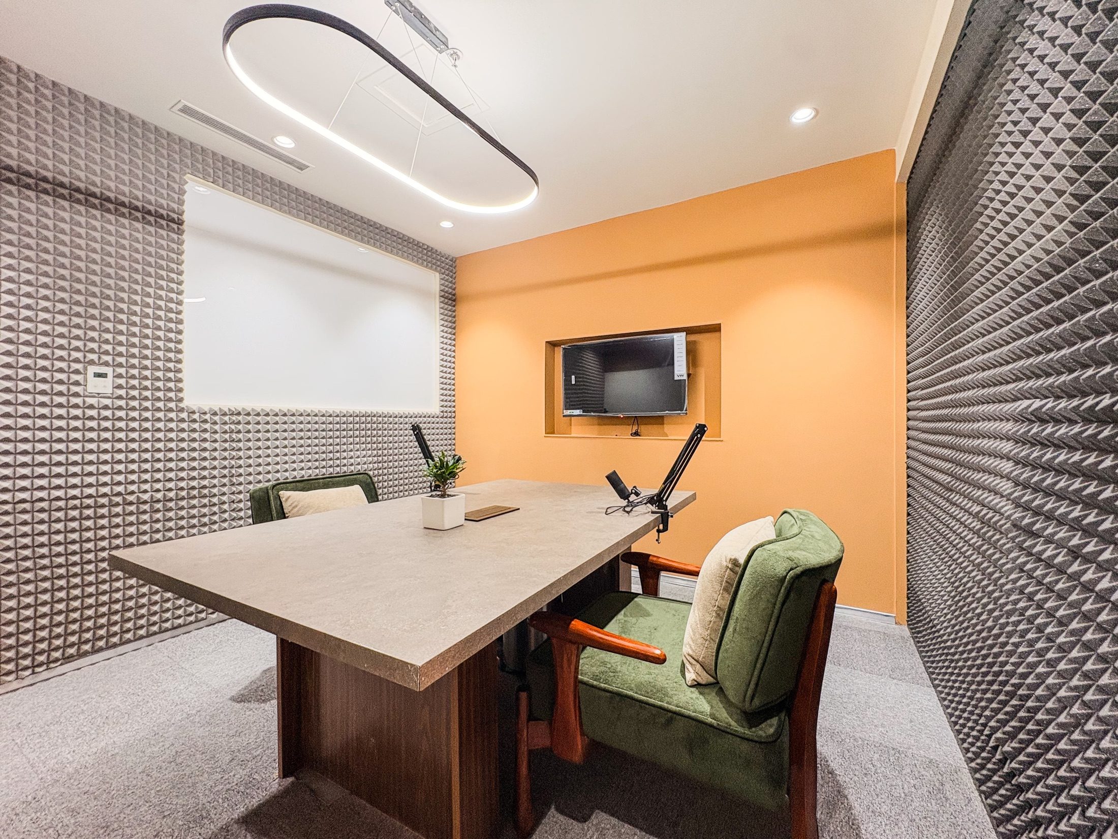 Podcast and content room at Limelight Coworks with acoustic panels and recording equipment