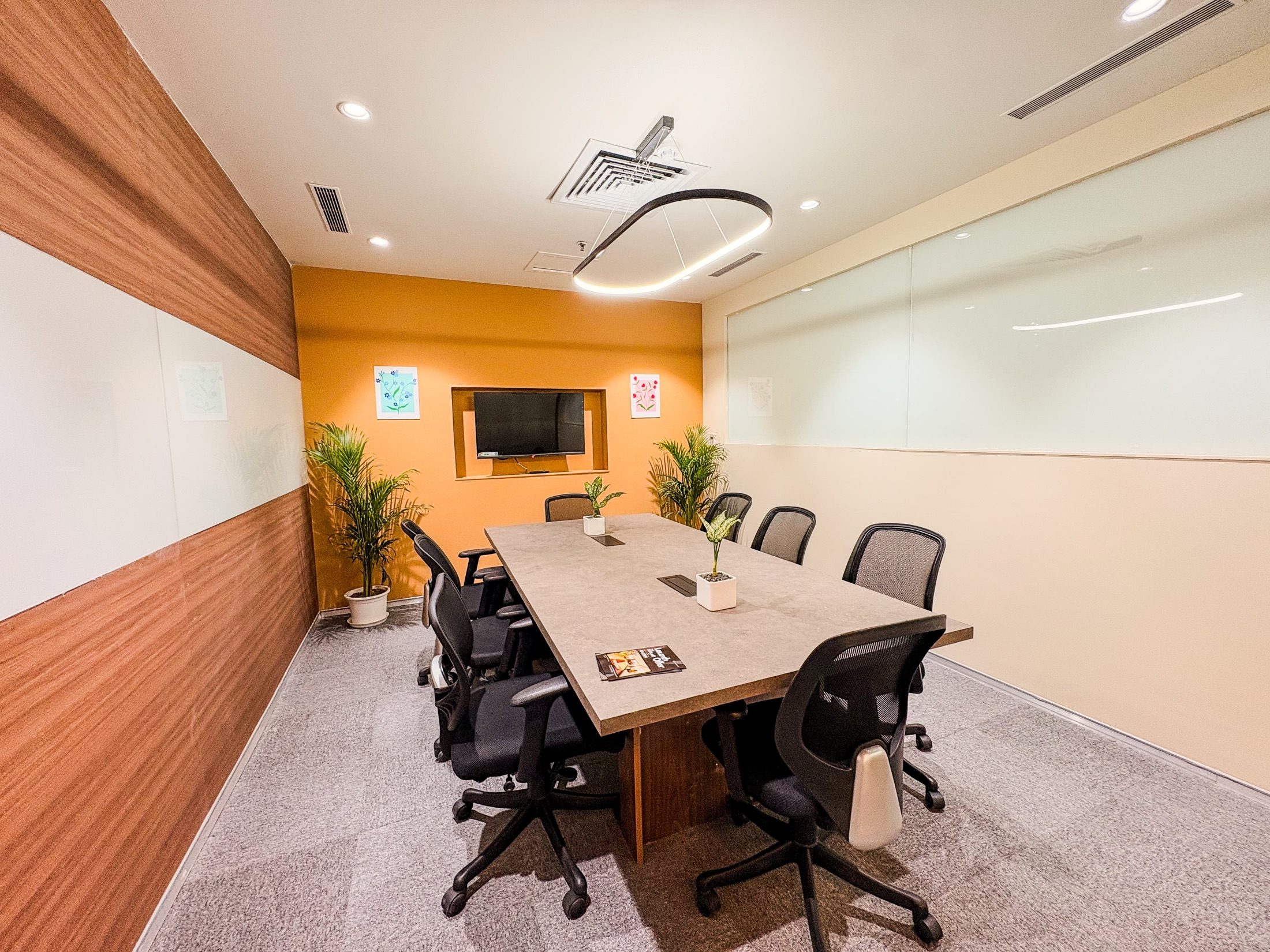 Window-side workbar at Limelight Coworks with high chairs and city views